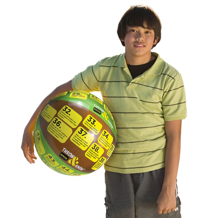 Older child holding Nutrition Throw & Know Activity Ball, health education inflatable ball with questions, Health Edco, 78006